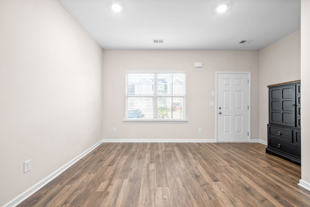 empty room with wood-type flooring