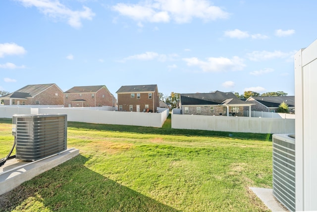 view of yard featuring central air condition unit