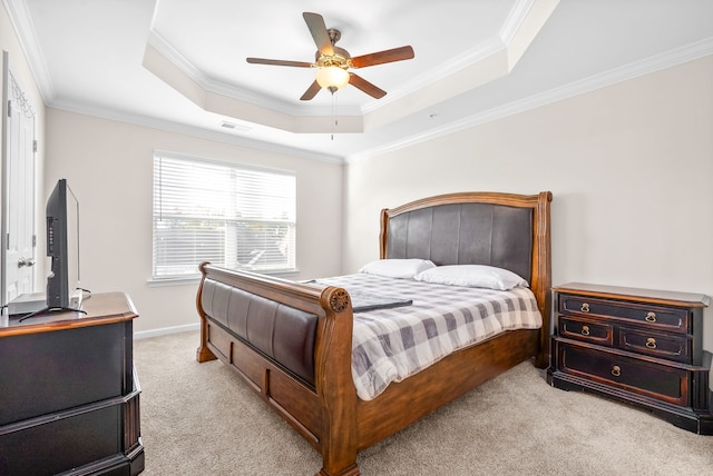 carpeted bedroom with crown molding, a raised ceiling, and ceiling fan