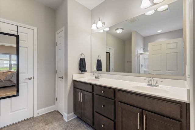 bathroom featuring vanity and a shower with shower door