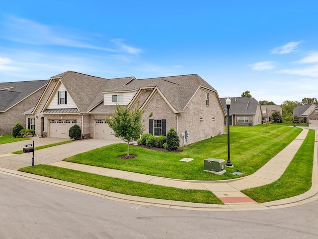 view of front of home with a front yard and a garage