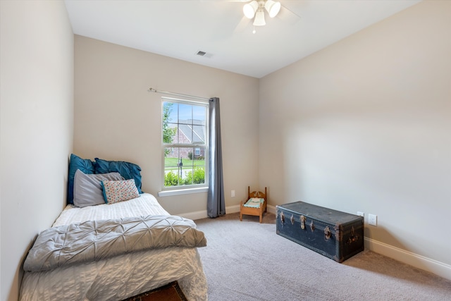 bedroom featuring ceiling fan and carpet