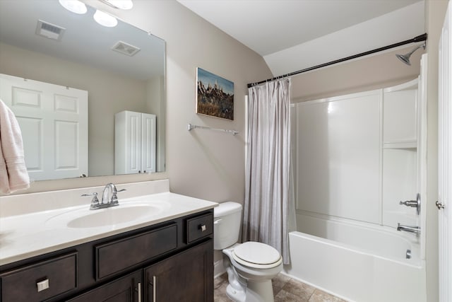 full bathroom with vanity, shower / bath combo, toilet, and tile patterned floors