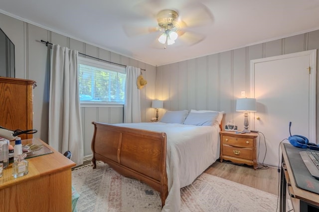 bedroom with light wood-type flooring and ceiling fan