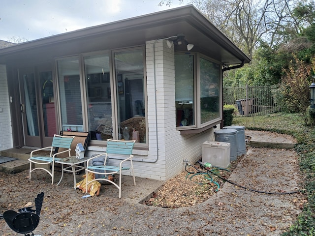 exterior space featuring a sunroom