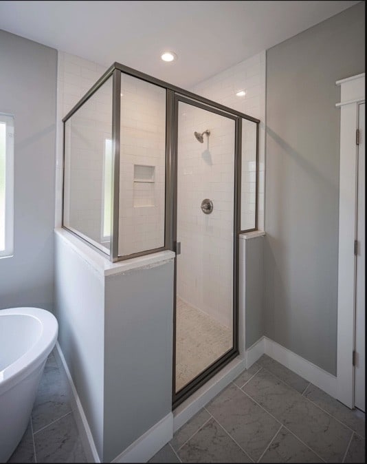 bathroom with separate shower and tub