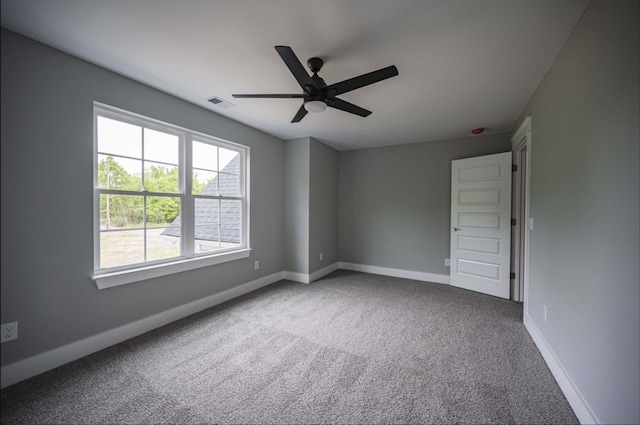 unfurnished room featuring carpet flooring and ceiling fan