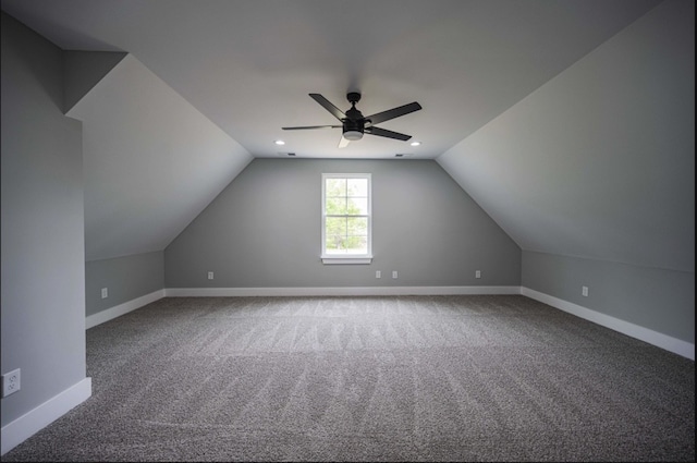 additional living space featuring ceiling fan, vaulted ceiling, and carpet floors