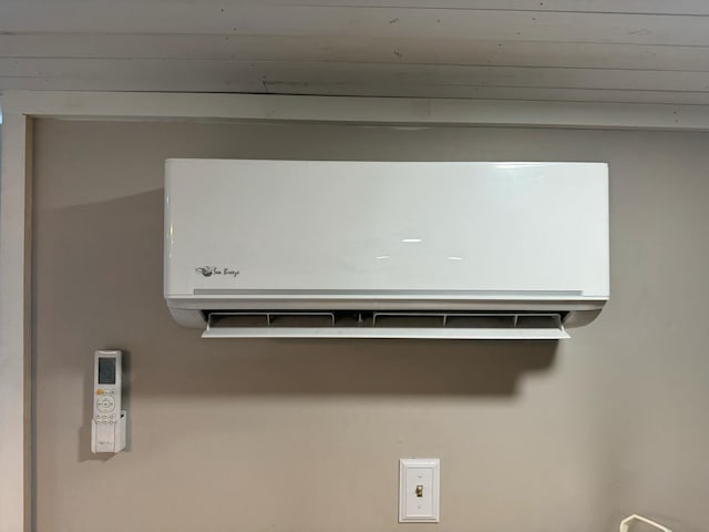 details featuring a wall mounted air conditioner