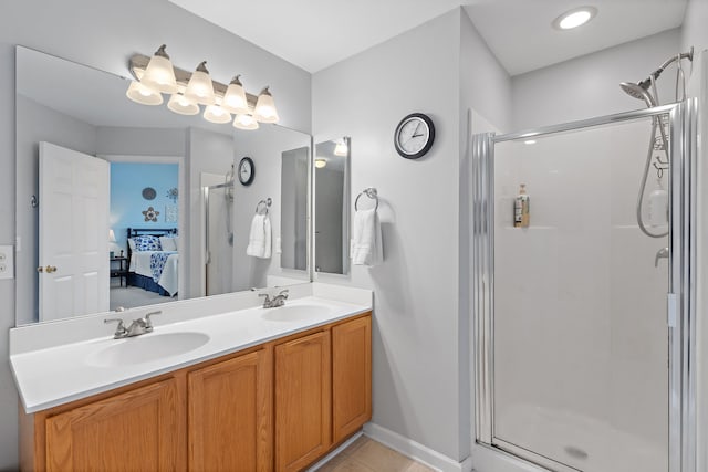 bathroom featuring vanity, an enclosed shower, and tile patterned flooring