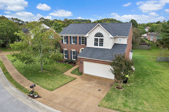 view of front facade with a front lawn and a garage