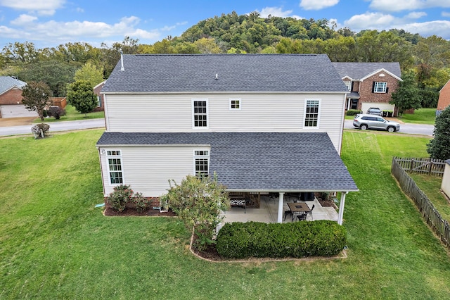 view of home's exterior featuring a patio and a yard