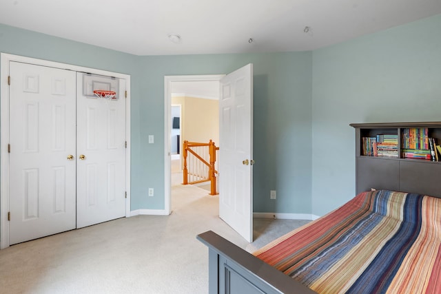 carpeted bedroom with a closet