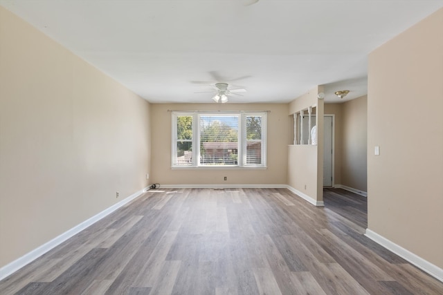 spare room featuring ceiling fan and hardwood / wood-style flooring