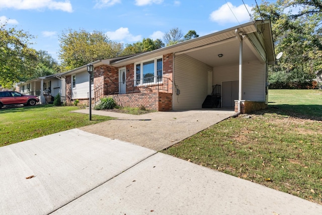 ranch-style home with a carport and a front yard