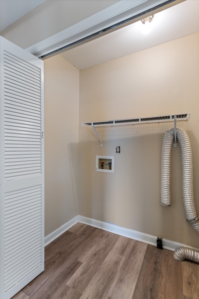 laundry area with hookup for a washing machine and hardwood / wood-style floors