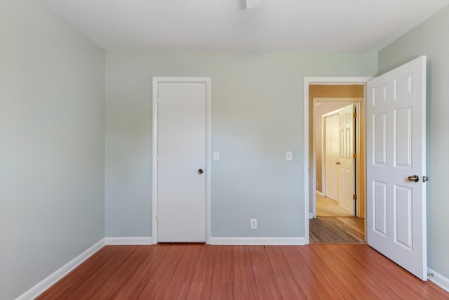 unfurnished bedroom with wood-type flooring