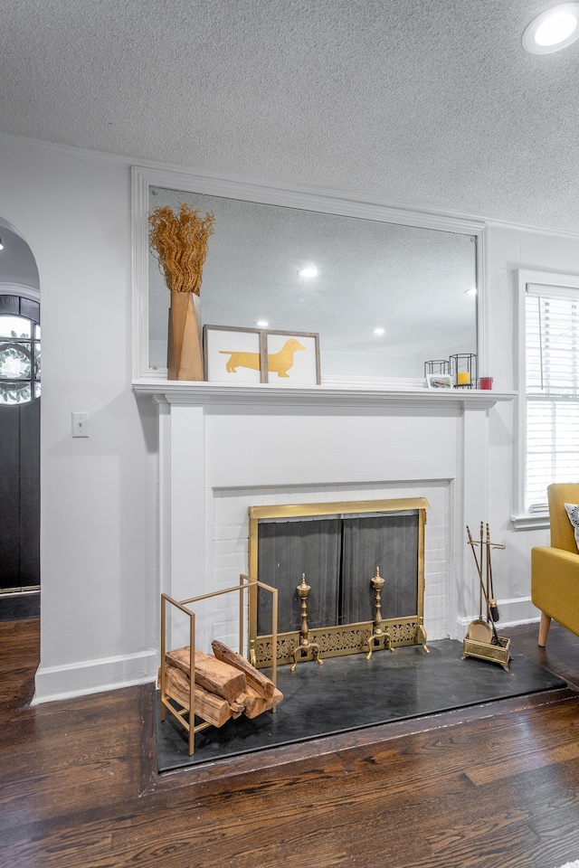 room details featuring a textured ceiling and hardwood / wood-style floors