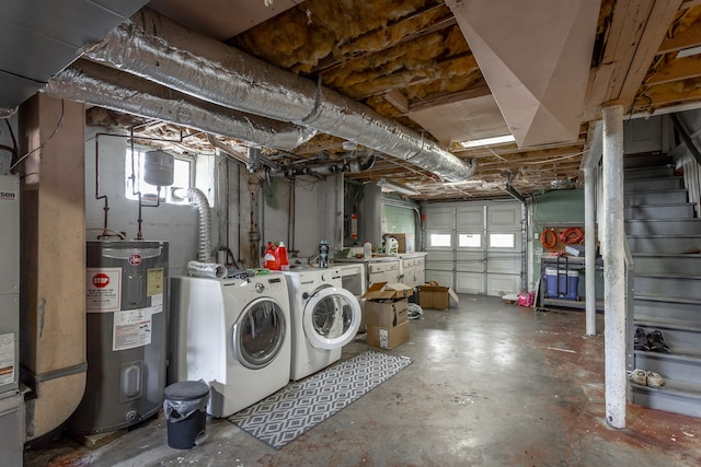 interior space featuring electric water heater and independent washer and dryer