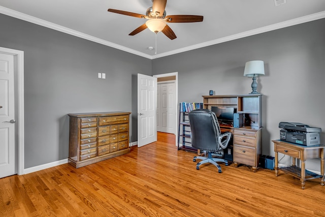 office area with light hardwood / wood-style floors, ornamental molding, and ceiling fan