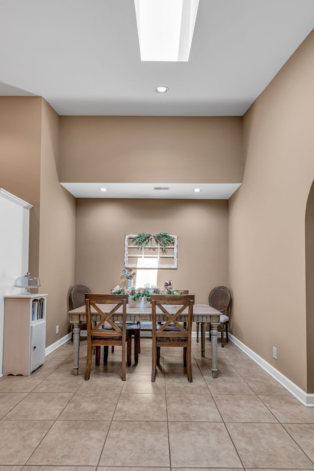 dining space with light tile patterned floors