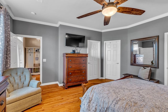 bedroom featuring ceiling fan, ornamental molding, and light wood-type flooring