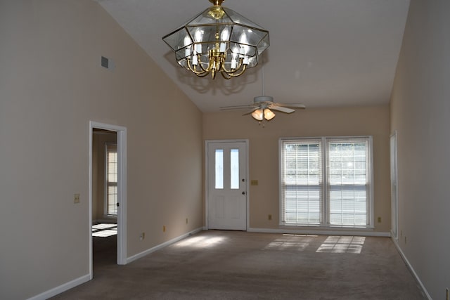 entryway with high vaulted ceiling, carpet floors, and ceiling fan with notable chandelier