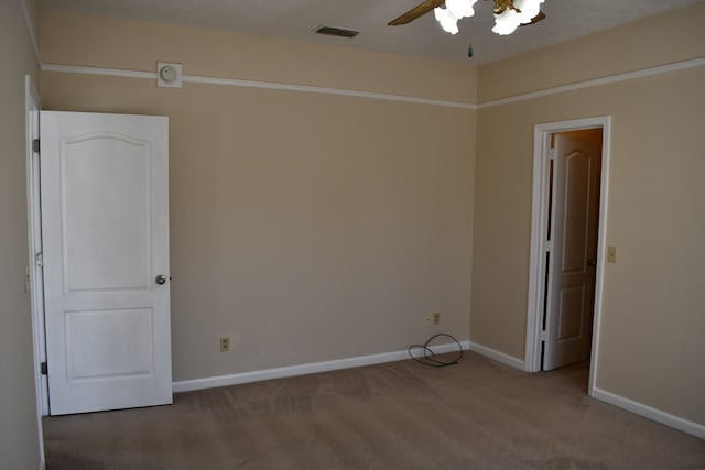 unfurnished room with carpet floors and ceiling fan