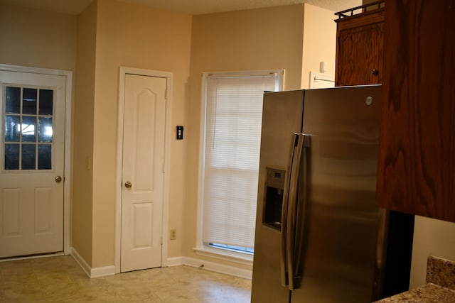 kitchen featuring stainless steel fridge