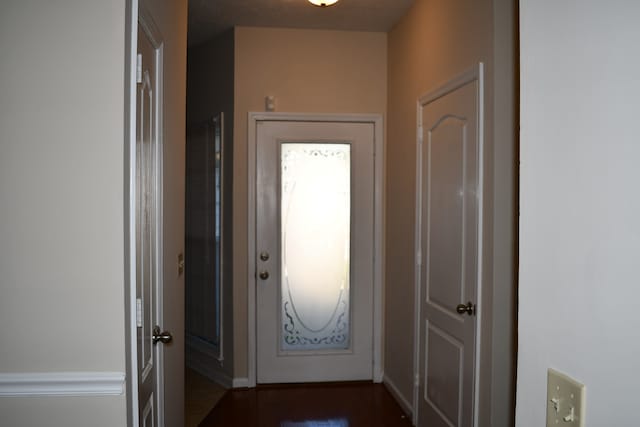 hallway featuring dark hardwood / wood-style floors