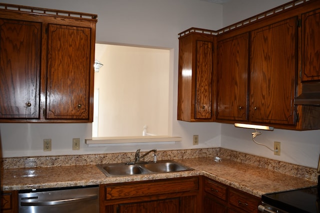 kitchen with stainless steel dishwasher, sink, and light stone counters