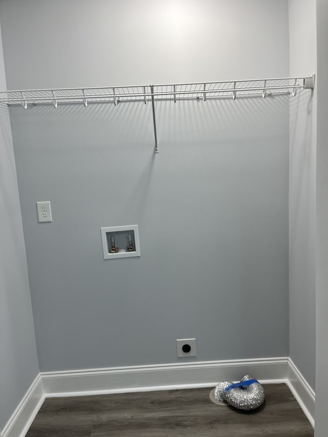 washroom featuring electric dryer hookup, washer hookup, and dark hardwood / wood-style flooring