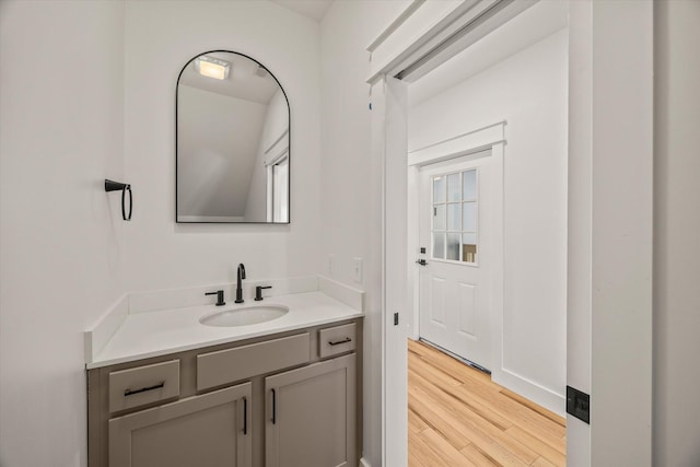 bathroom with vanity and wood-type flooring