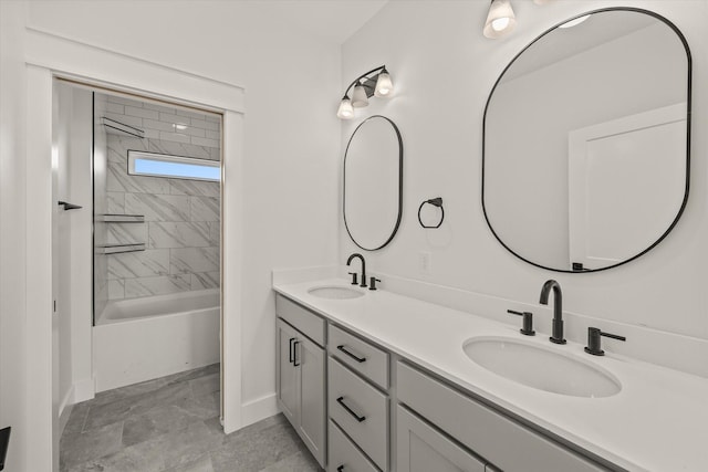 bathroom featuring vanity and tiled shower / bath