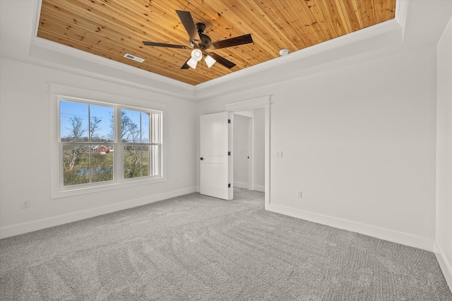 unfurnished room featuring ornamental molding, carpet floors, ceiling fan, and wooden ceiling