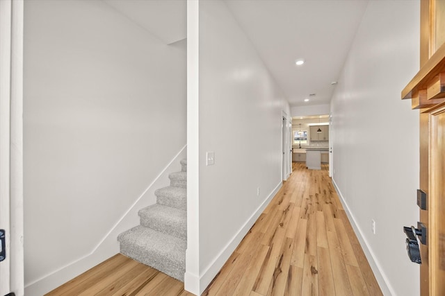 hall with light wood-type flooring