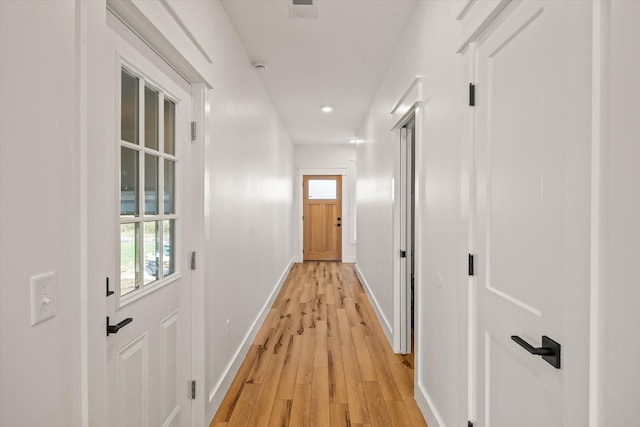 hall with light wood-type flooring