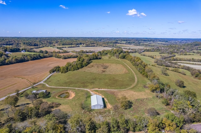 birds eye view of property with a rural view