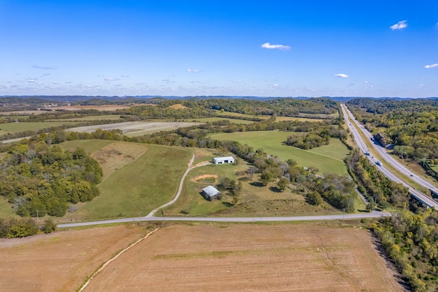 birds eye view of property with a rural view