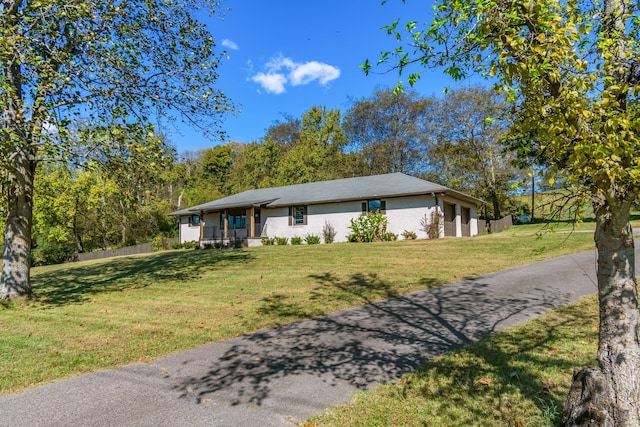 ranch-style house with a front yard