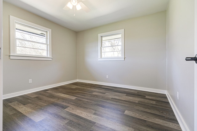 unfurnished room featuring dark wood-type flooring, ceiling fan, and a healthy amount of sunlight