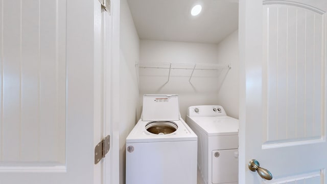 clothes washing area featuring washing machine and clothes dryer