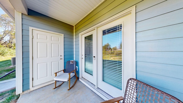 doorway to property featuring central AC unit