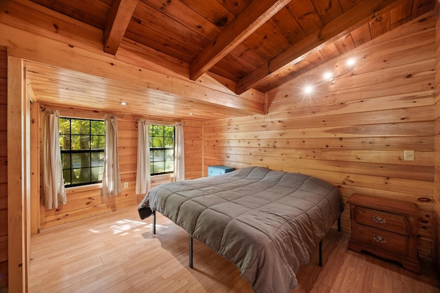 bedroom featuring vaulted ceiling with beams, wooden walls, wood ceiling, and light hardwood / wood-style floors