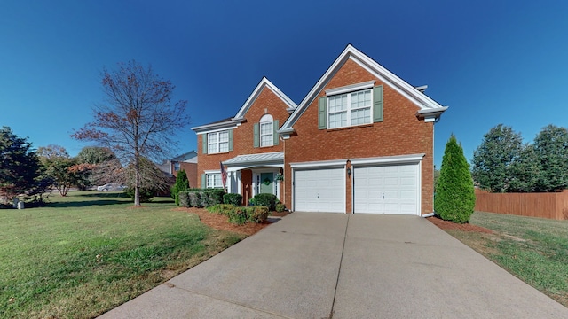 front of property with a front lawn and a garage