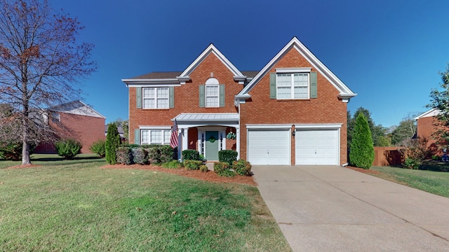 view of front of home with a front lawn and a garage