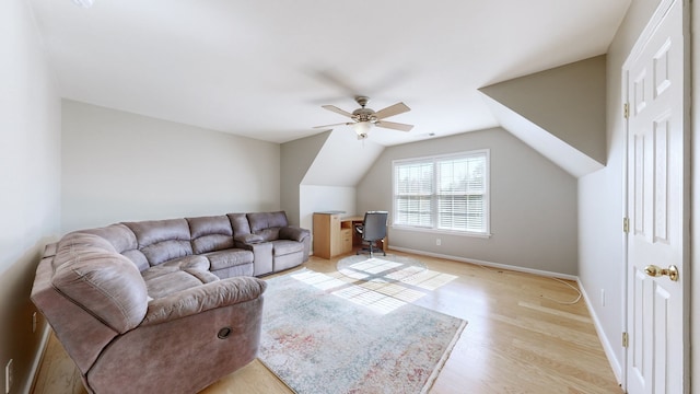 living room featuring lofted ceiling, light hardwood / wood-style flooring, and ceiling fan