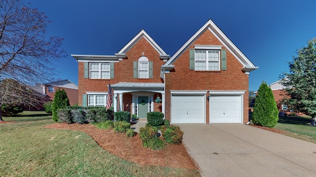 view of front of home with a garage and a front lawn