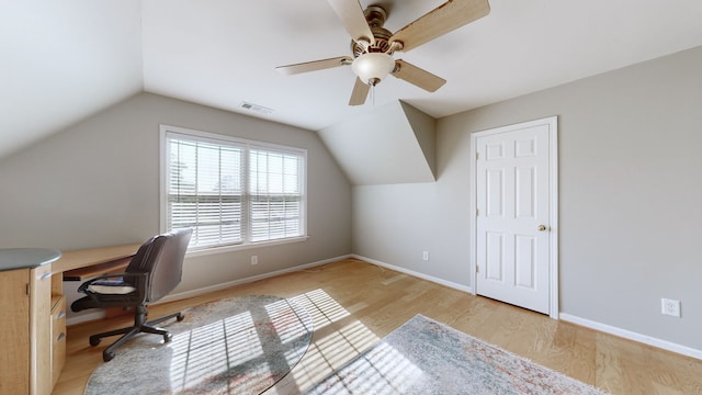 office area featuring lofted ceiling, light hardwood / wood-style flooring, and ceiling fan