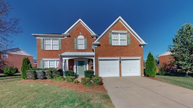 view of front facade featuring a garage and a front lawn